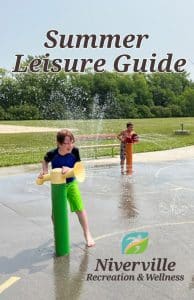 An image of two children playing in the Splash Pad located at Hespeler Park